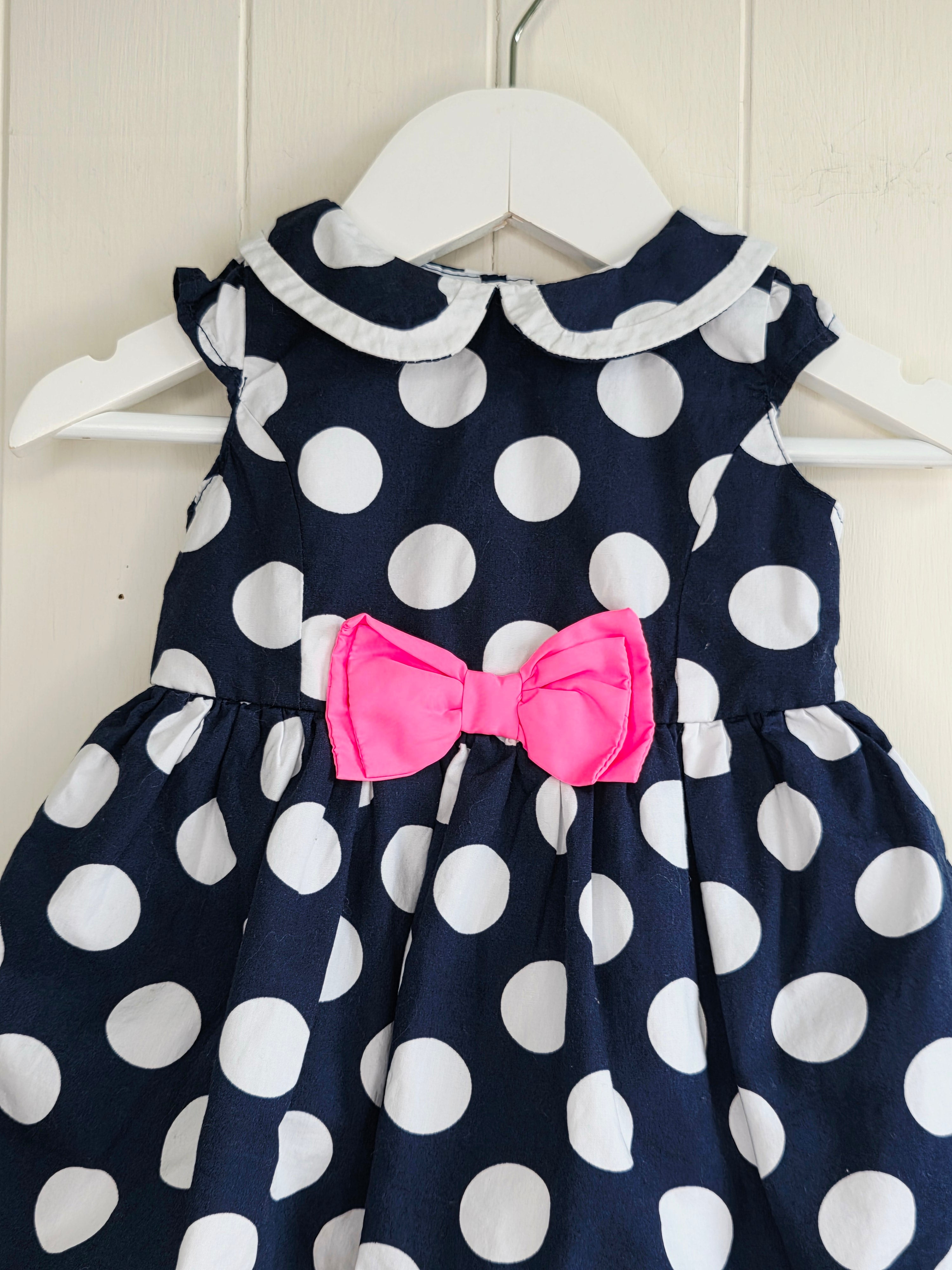 Early days - 3-6 months girls navy blue sleeveless dress featuring giant polka dots and Peter Pan collar