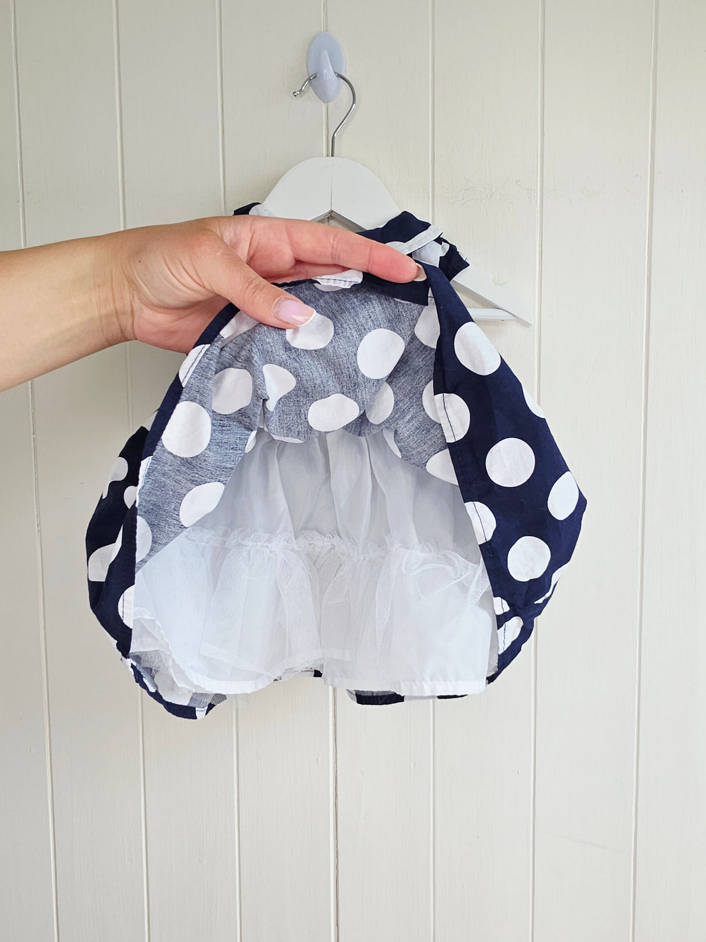 Early days - 3-6 months girls navy blue sleeveless dress featuring giant polka dots and Peter Pan collar