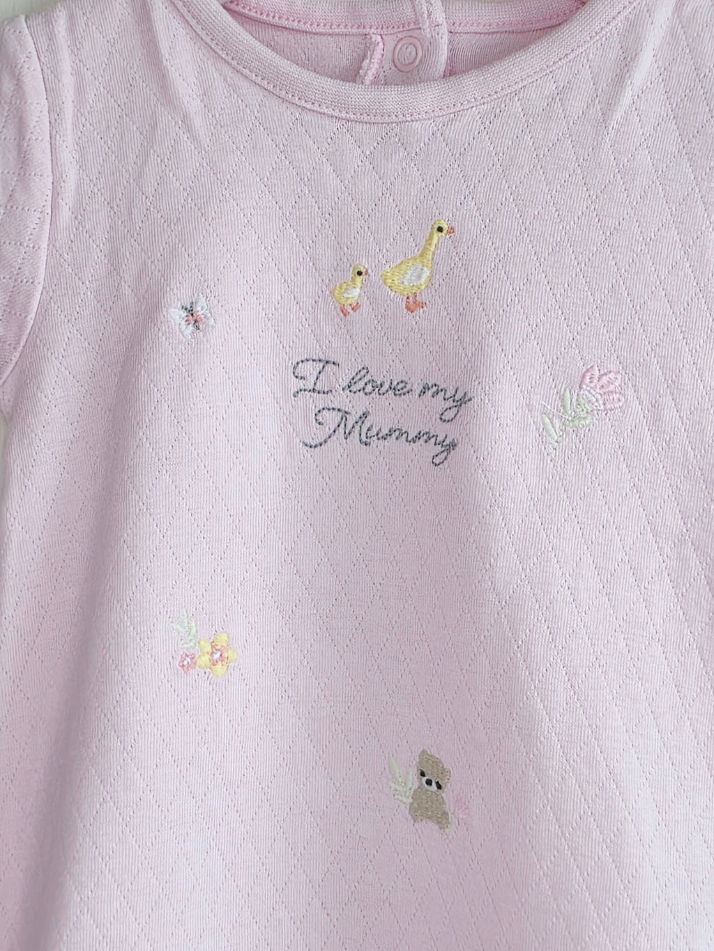 Nutmeg - 3-6 months girls pink romper featuring embroidered animals